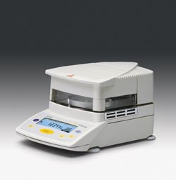 Combined moisture analyser and weighing system